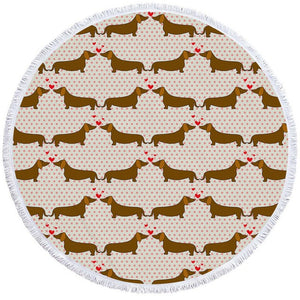 Image of a round dachshund towel with dachshunds kissing on cream with pink polka dots background