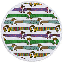 Load image into Gallery viewer, Image of a round dachshund towel with dachshunds wearing sweaters on white background