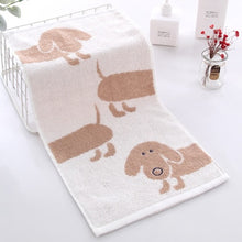 Load image into Gallery viewer, Image of a dachshund cotton hand towel in the color tan brown