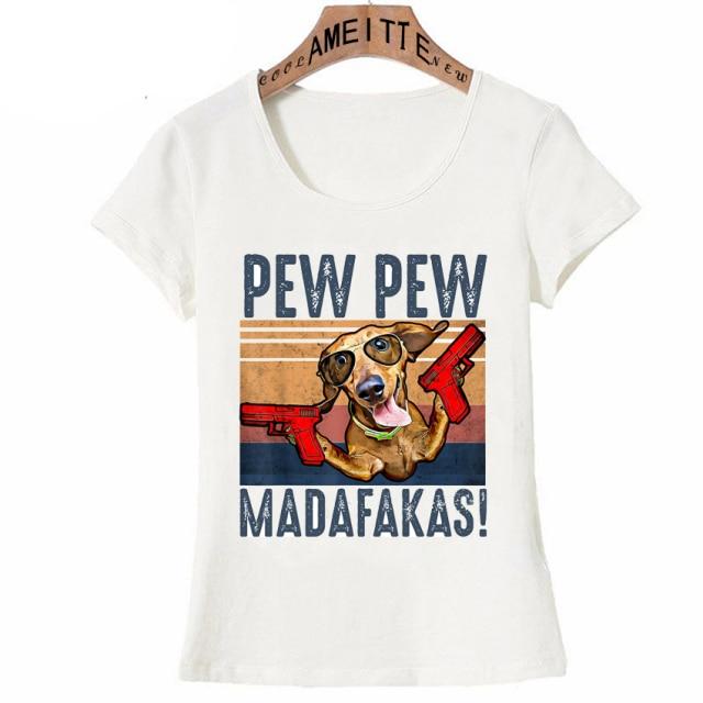 Image of a Dachshund t-shirt featuring a super-cute red Dachshund with sunglasses and guns in his hands and the text which says 