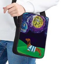 Load image into Gallery viewer, Image of a lady holding a Dachshund messenger bag