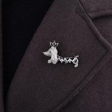 Load image into Gallery viewer, Image of a Dachshund brooch pin on coat made of white gold plated metal alloy and AAA cubic zirconia