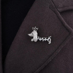 Image of a Dachshund brooch pin on coat made of white gold plated metal alloy and AAA cubic zirconia
