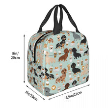 Load image into Gallery viewer, Image of the size of an insulated Dachshund lunch bag with exterior pocket in dachshund and coffee design