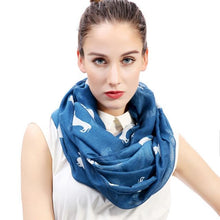 Load image into Gallery viewer, Image of a girl wearing a beautful Dachshund scarf in the color denim blue with infinite Dachshunds design