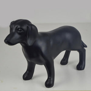 Image of a beautiful black Dachshund statue made of resin