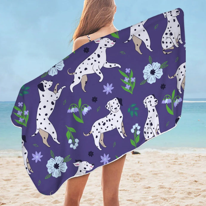 Image of a lady flaunting Dalmatian beach towel at the beach in purple flower garden Dalmatian design