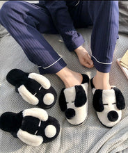 Load image into Gallery viewer, Image of a person wearing Dalmatian slippers in black and white