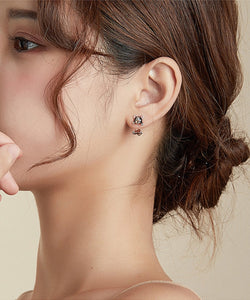Image of a lady wearing sterling silver boston terrier earrings