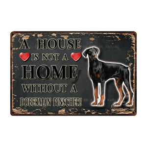 Image of a Doberman Signboard with a text 'A House Is Not A Home Without A Doberman Pinscher' on a dark background