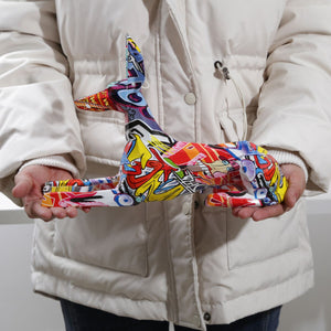 Image of a person holding stunning multicolor doberman statue