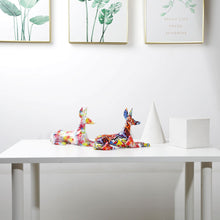 Load image into Gallery viewer, Image of two stunning multicolor doberman statues on a white table