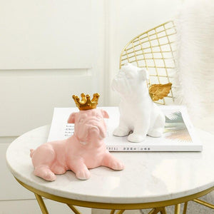 Image of two english bulldog statues in the color pink and white