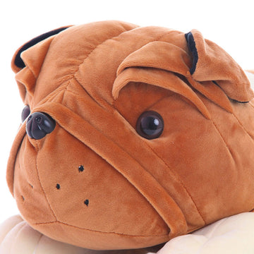 Close up view of an English Bulldog stuffed animal in orange and white