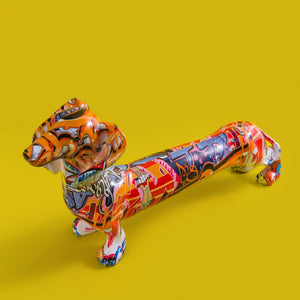 Image of a upper view of multicolor extra long graffiti dachshund statue