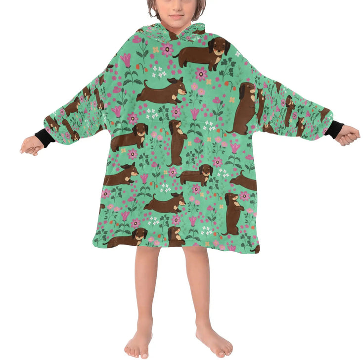 image of a kid wearing of a dachshund blanket hoodie for kids - green