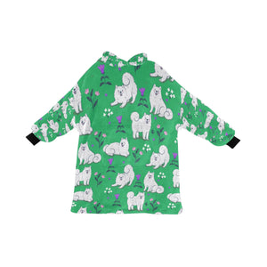 image of a green samoyed blanket hoodie for women