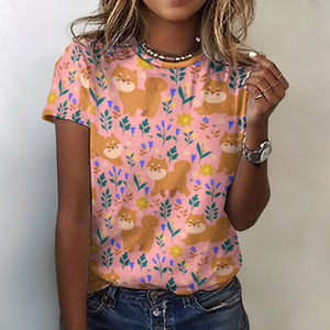 image of a woman wearing a peach shiba inu all over print t-shirt