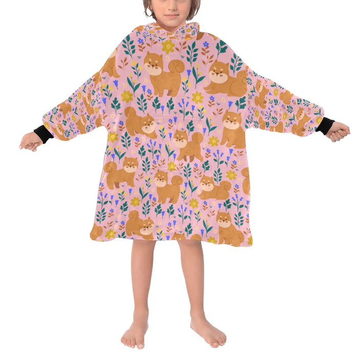 image of a kid wearing Shiba Inu blanket hoodie for kids - light pink