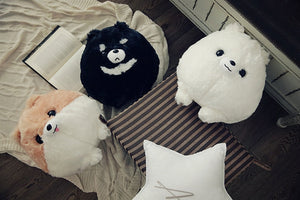 Image of three adorable stuffed Dog plush toy pillows looking up