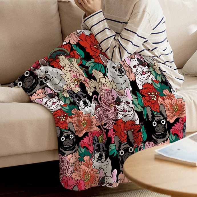Image of a girl covered with super cute French Bulldog blanket on a sofa with infinite French Bulldogs in all colors design
