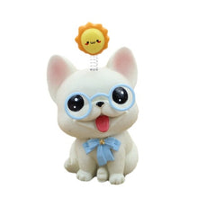 Load image into Gallery viewer, Image of a french bulldog bobblehead in the smiling White Frenchie babyface, wearing sky blue glasses, a matching bow-tie, with a bouncy yellow sun on his or her mind