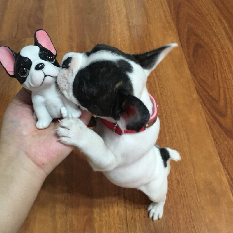 Image of a frenchie kissing french bulldog figurine in the color pied black and white