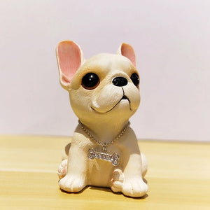 Image of a sitting french bulldog figurine in the color fawn
