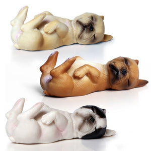 Image of three french bulldog figurines sleeping on back