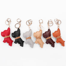 Load image into Gallery viewer, Image of six french bulldog leather keychains in different colors