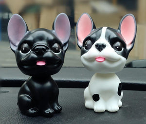 Image of two french buldog bobbleheads in the color black and pied black and white