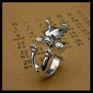 Image of a silver french bulldog ring in the cutest hanging French Bulldog design