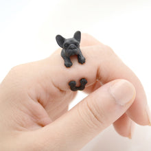 Load image into Gallery viewer, Image of a finger wrap french bulldog ring on the finger of a person in the color Black Gun