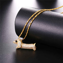 Load image into Gallery viewer, Image of a stone studded dachshund necklace in the color gold