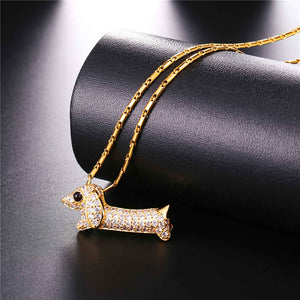 Image of a stone studded dachshund necklace in the color gold