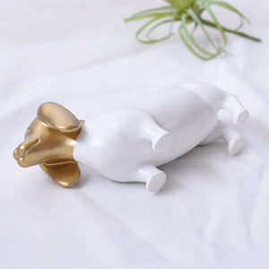 Laying image of a beautiful white and gold colored Dachshund jewelry box