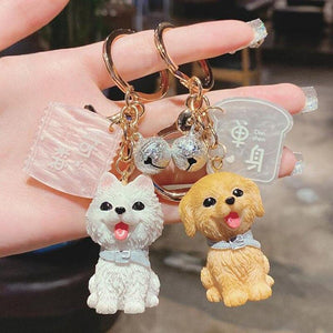 Image of a super-cute Golden Retriever and American Eskimo Dog keychain in 3D designs