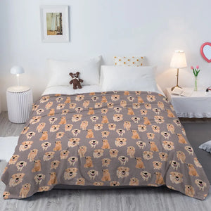Image of a Golden Retriever blanket in an infinite smiling Golden Retrievers design kept on the bed