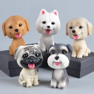 Image of five dog bobbleheads including Golden Retriever, Samoyed, Labrador, Pug, and Schnauzer bobblehead