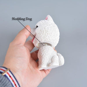 Image of a Samoyed bobblehead side view holding by a person