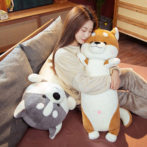 image of a woman hugging a shiba inu stuffed animal plush toy pillow