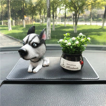 Load image into Gallery viewer, Image of a sitting husky bobblehead on car dashboard