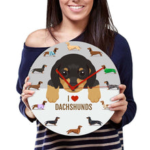 Load image into Gallery viewer, Image of a girl holding i heart dachshund wall clock