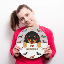 Load image into Gallery viewer, Image of a girl holding weiner dog wall clock