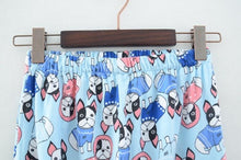 Load image into Gallery viewer, Image of boston terrier pajama pants hung on a hanger