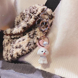 Image of a super-cute Bichon Frise keychain hanging to a bag in 3D Bichon Frise design