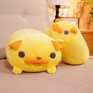 this image shows the cute, adorable pug stuffed animal plush pillows laying on the sofa in two different sizes.