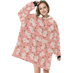 image of a woman wearing a bichon frise blanket hoodie for women - peach