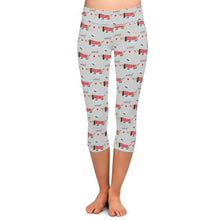Load image into Gallery viewer, Image of a girl wearing sausage dog leggings
