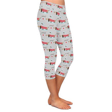 Load image into Gallery viewer, Image of a girl wearing weiner dog leggings